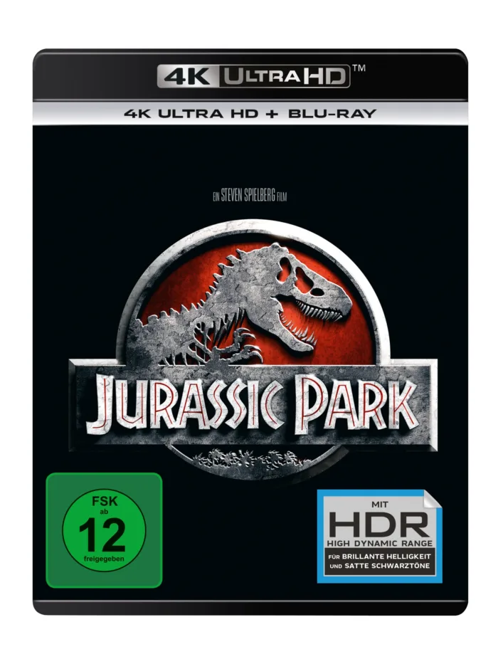 4K-Disc-Cover von Jurassic Park, es zeigt ein rotes Siegel mit grauen Umrissen eines Tyrannosaurus sowie den Titel in großen Lettern: "JURASSIC PARK"