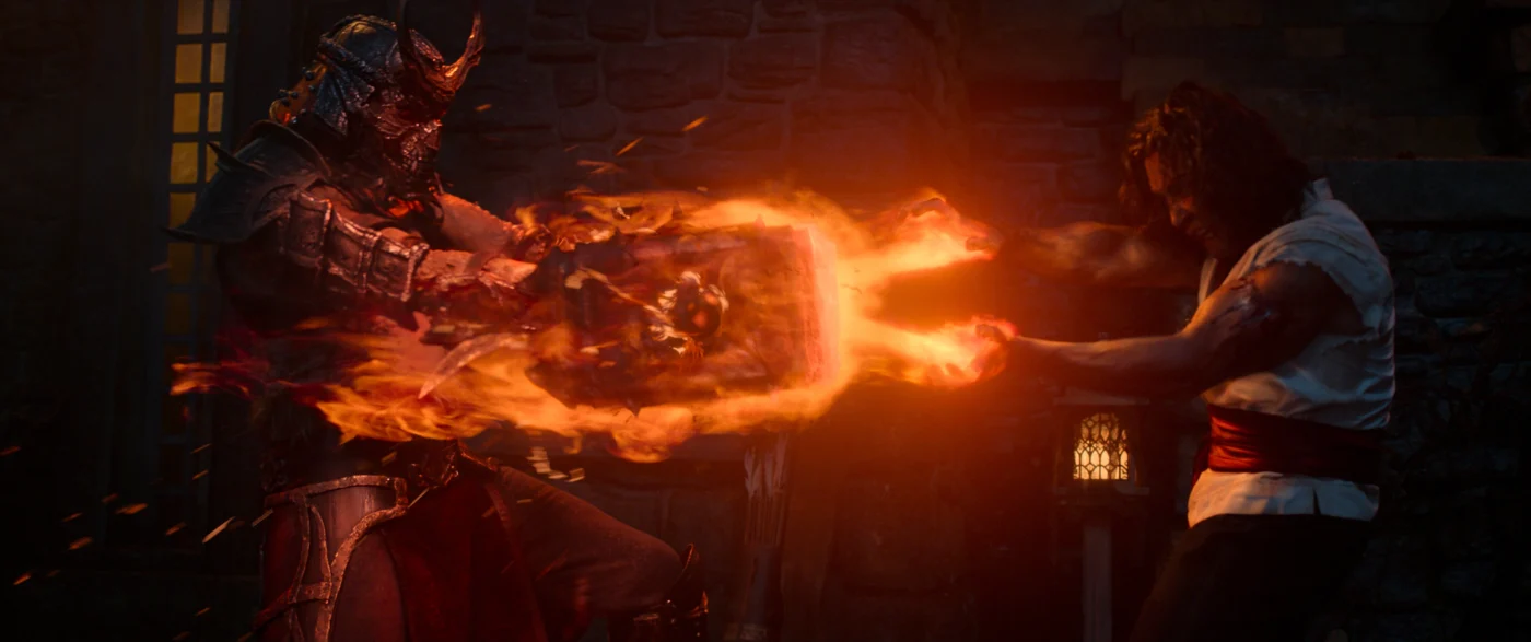 Szenenbild aus Mortal Kombat II: Eine Gestalt in Ritterrüstung und ein Mann stehen sich gegenüber. Der Mann schießt Feuer aus seinen Händen.